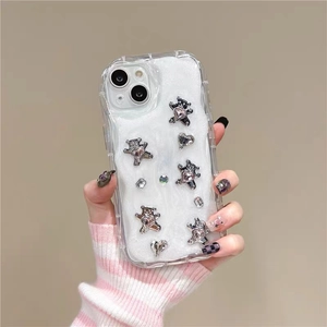 Detailed view of luxury rhinestone 3D bear and heart on iPhone case with mica glitter base