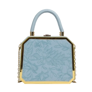 Light blue floral embossed box handbag with gold chain strap and metal frame