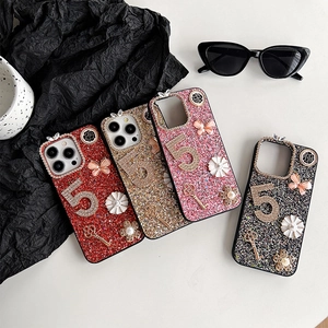 Sparkly glitter iPhone cases with luxury rhinestone number 5, pearls, and butterfly charms