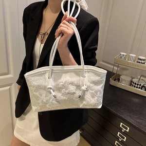 White tote bag with floral lace butterfly embroidery and sleek white leather handles
