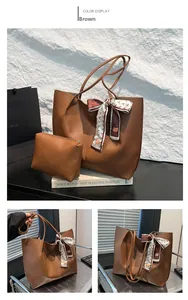 Vue détaillée d'un sac cabas marron avec foulard en soie et pochette assortie
