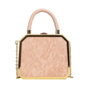 Pink octagon evening bag with floral embossing and gold metal frame with chain