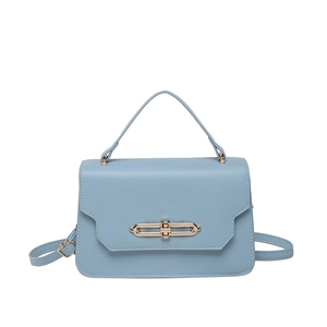 Light blue minimalist leather handbag with gold metal clasp and adjustable shoulder strap