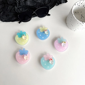5-piece set of strawberry phone ring holders in soft pastel macaron colors with polka dots