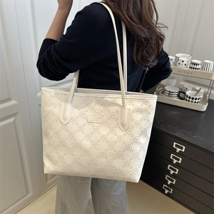 Stylish large white floral debossed tote bag for women with comfortable shoulder straps