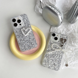 Sparkly glitter iPhone case with pearl heart and bow pendant for a sweet aesthetic look