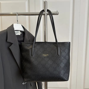 Fashionable large capacity black tote bag with embossed flower patterns for women