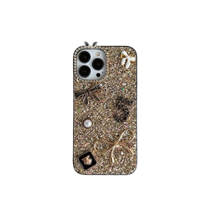 Glitter iPhone case with golden sequins, pearl bows, rhinestone 5 and leopard head charm