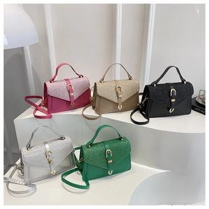 Glitter envelope handbags collection in five colors with sleek metallic clasps and straps
