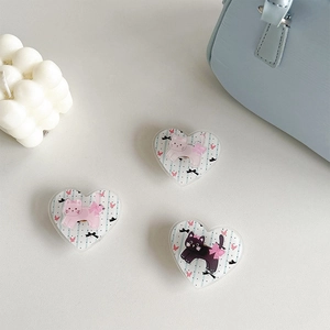 Three heart-shaped popsocket phone grips featuring cute cartoon cats and blue stripes