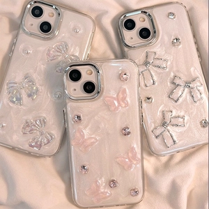 Glitter butterfly iPhone case with 3D pearl bow and rhinestone accents on white fabric
