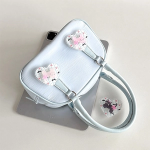 Light blue bow cat heart handbag with textured faux leather and shoulder strap