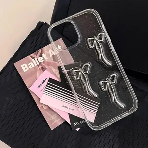 Clear iPhone case with three silver bows and glitter glitter flakes for a balletcore aesthetic