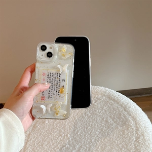 Detail of iPhone case with gold foil, white butterfly charms and golden turtle pendant