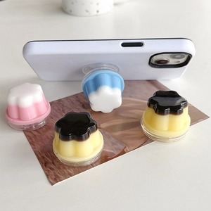 Detail showing pudding-shaped phone pop sockets in diverse colors on a magazine base