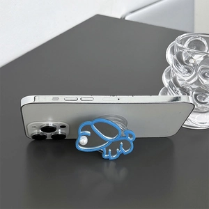 Close-up of a blue cartoon dog phone grip with a mirror finish and pearl detail