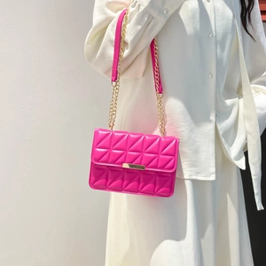 Minimalist quilted rose pink shoulder bag with geometric pattern and gold chain strap