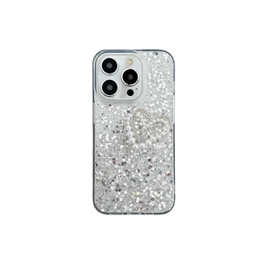 Glitter iPhone 16 Pro Max case with 3D pearl heart design and shiny silver sequins