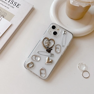 Close-up of clear iPhone case with silver angel heart and soda tab metal charms