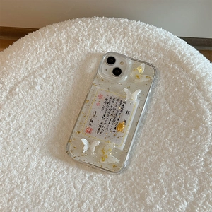 Detail of iPhone case with gold foil, 3D butterfly, and Japanese money turtle charm