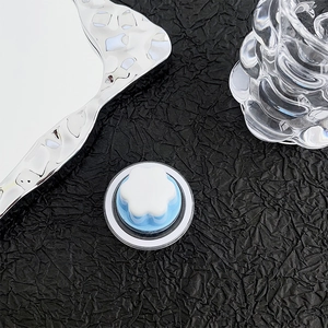 Macro shot of 3D floral magnetic phone grip on a stylish metallic background