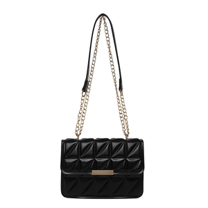 Elegant black quilted crossbody bag with gold chain strap and textured leather finish