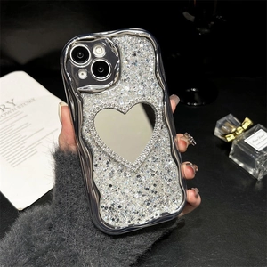 Close-up of luxury silver plated iPhone case with heart mirror and sparkling glitter finish
