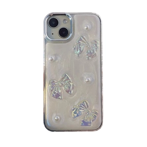Glittery butterfly iPhone case with 3D bows and pearls on a sleek cream silicone base