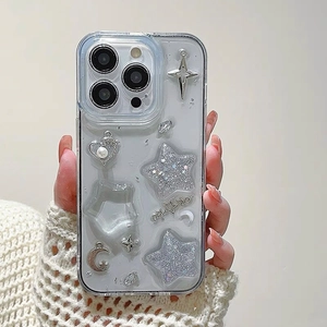 Detail of glitter iPhone case with silver stars, pearl hearts, and moon decorations