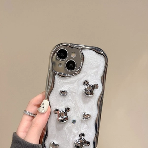 Macro detail of silver plated wavy phone case with Mickey mouse rhinestones