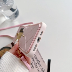 Pink quilted leather phone case with card holder and crossbody strap for iPhone