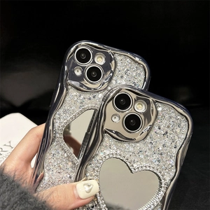 Silver glitter iPhone case featuring a wavy electroplated edge and heart mirror detail