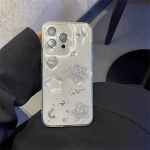 Detail of iPhone case with glitter stars, crescent moon, and pearl heart charms