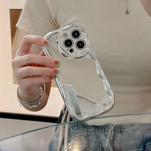 Close-up of a silver mirror wavy phone case for iPhone showing reflective surface