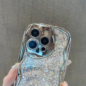 Macro shot of silver wavy edge phone case with glitter sequins and camera lens protection