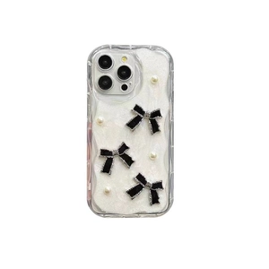 White glitter iPhone case with black 3D bows and pearls on a clear frame back