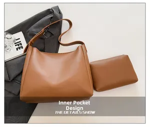 Detail view of the brown tote bag inner pouch design with high-quality leather texture