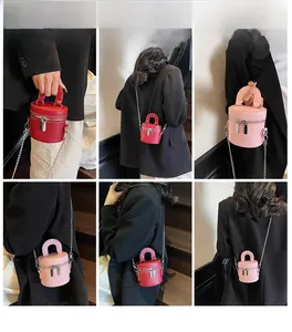 Detailed views of red and pink mini barrel bags with chain straps on a female model