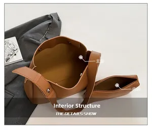 Top view of brown tote bag internal structure with main compartment and matching inner pouch