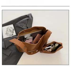 Top view of large brown leather tote bag with inner pouch showing spacious interior