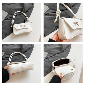 Detailed views of white baguette bag featuring gold bow hardware and knotted shoulder strap