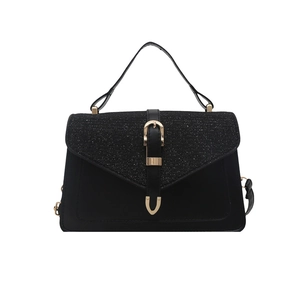 Elegant black handbag with glitter contrast panel and golden U-shaped buckle closure