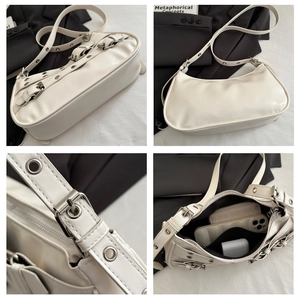 Detail view of white PU leather hobo bag with metal eyelets and adjustable strap features