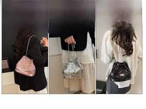 Sequin drawstring bucket bag with metal chain strap and logo in pink, silver and black