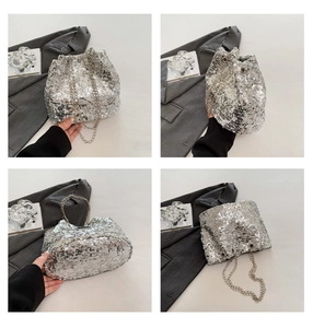 Detail showing the silver sequin bucket bag texture and shiny metallic chain strap