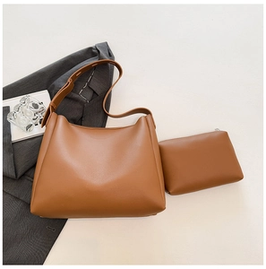 Close-up of minimalist brown PU leather tote bag set including matching zipper pouch