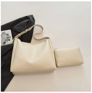 Detailed view of cream PU leather tote bag set with matching inner pouch and wide strap