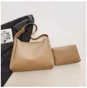 Detail view of khaki tote bag set with matching pouch and premium faux leather texture
