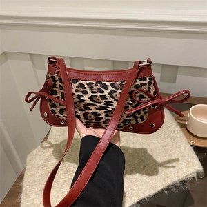 Retro leopard print underarm bag with dark red bows and smooth synthetic leather trim
