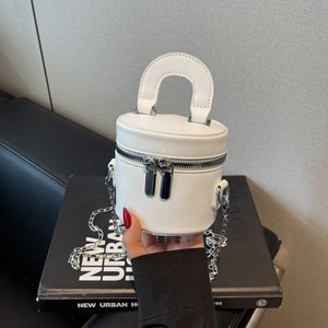 White mini cylinder bucket bag with double zippers and silver chain strap for women